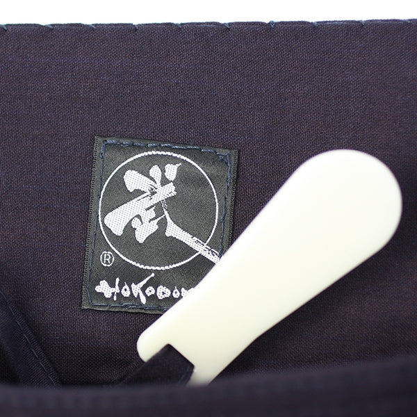 Hera and authentic Tozando label close-up.