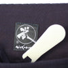 Hera and authentic Tozando label close-up.