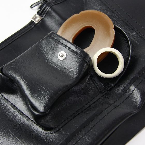 The example side pocket holding a tsuba and tsubadome.