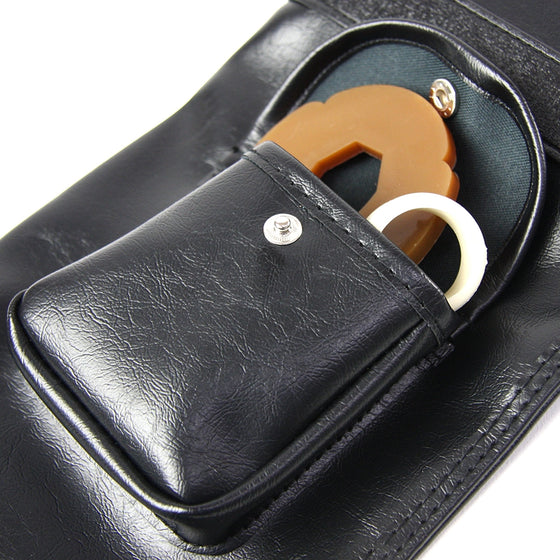 Close-up of the external pocket holding a tsuba and tsuba dome.