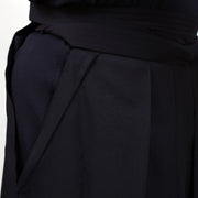 Dogi and hakama fabric side-by-side close-up.