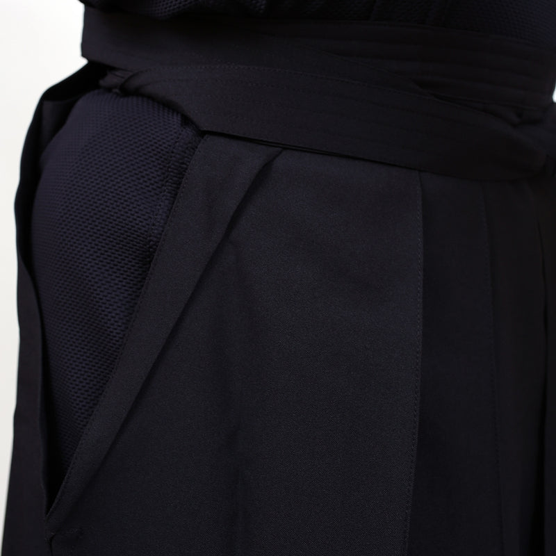 Dogi and hakama fabric side-by-side close-up.
