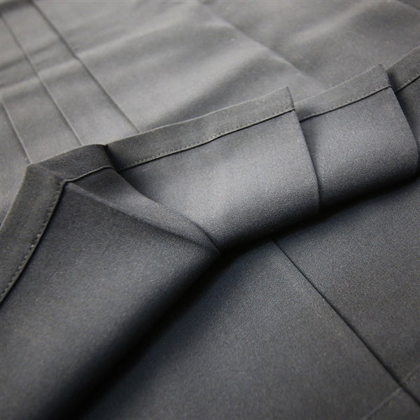 A view of the inner side of the lower hem and pleats.