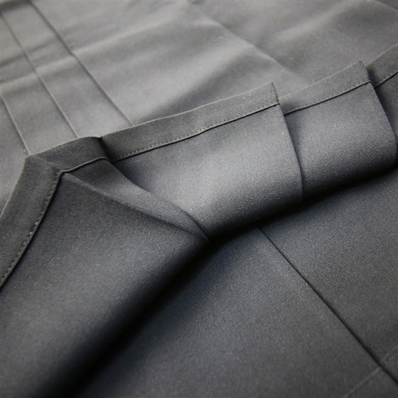 A view of the inner side of the lower hem and pleats.