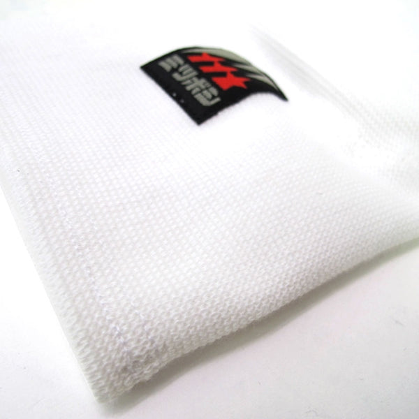 Close-up of the stretchy white fabric.