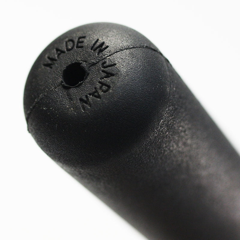 close-up of the tsuka-gashira and its made in japan stamp.