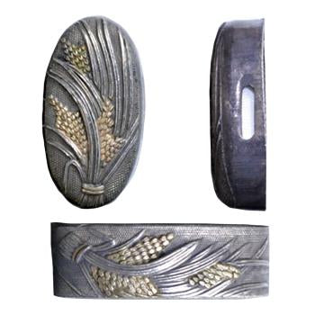 These copper fuchi and kashira are plated in silver with ears of rice gilded in gold.