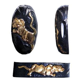 Tiger themed fuchi and kashira made from blackened brass.
