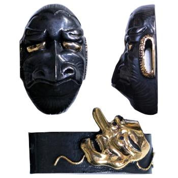 Fuchi and kashira made from brass that depict the mythical Tengu.