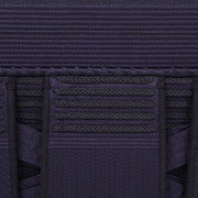 Close-up view of the decorative braids and tetknit fabric.