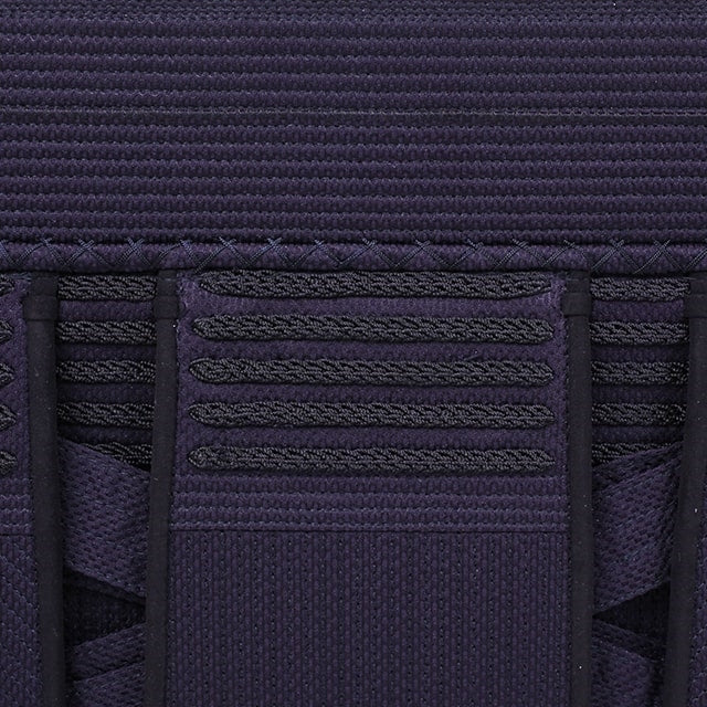 Close-up view of the decorative braids and tetknit fabric.