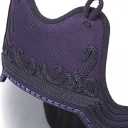 Side on close-up of the tetknit mune fabric and decoration.