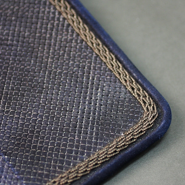 Close-up of the fine gunomezashi mendare and brown silk kazari ito.