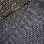 The kumozashi overstitching used on the deerskin of the tare.