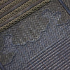 The kumozashi overstitching used on the deerskin of the tare.