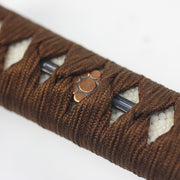 Close-up of the kuyomon menuki.