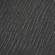 Super close-up of the fine wave patterns on the fabric.