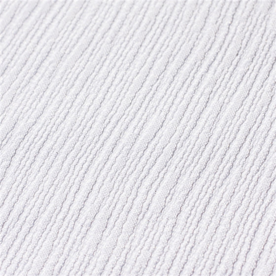 Close-up of the wave patterns on the white fabric.