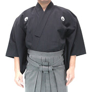 The poplin polyester dogi worn with the silket hakama.