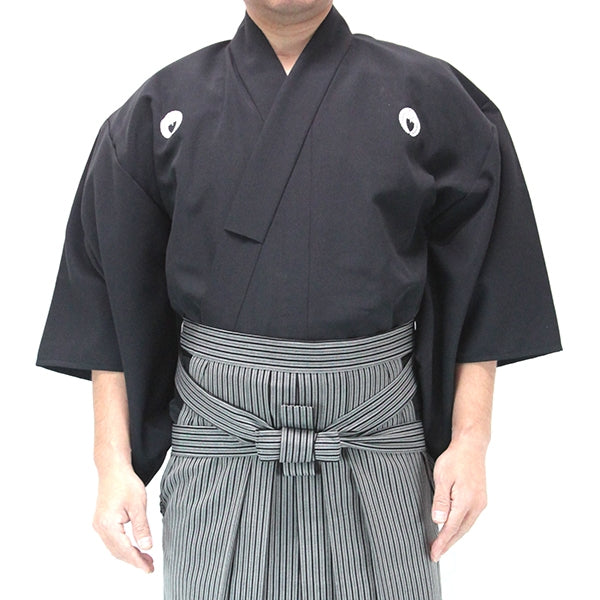 The poplin polyester dogi worn with the silket hakama.