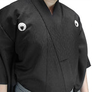 Close-up of the nami tsumugi dogi with customised kamon.