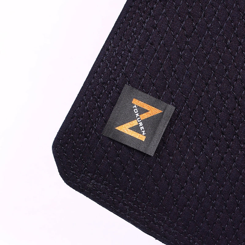 Close-up of the Tokuren Gold label and naname cross-stitch mendare.