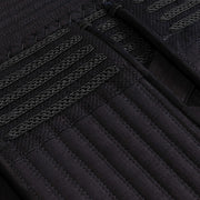 Close-up of the tornado-stitch odare and braidwork.