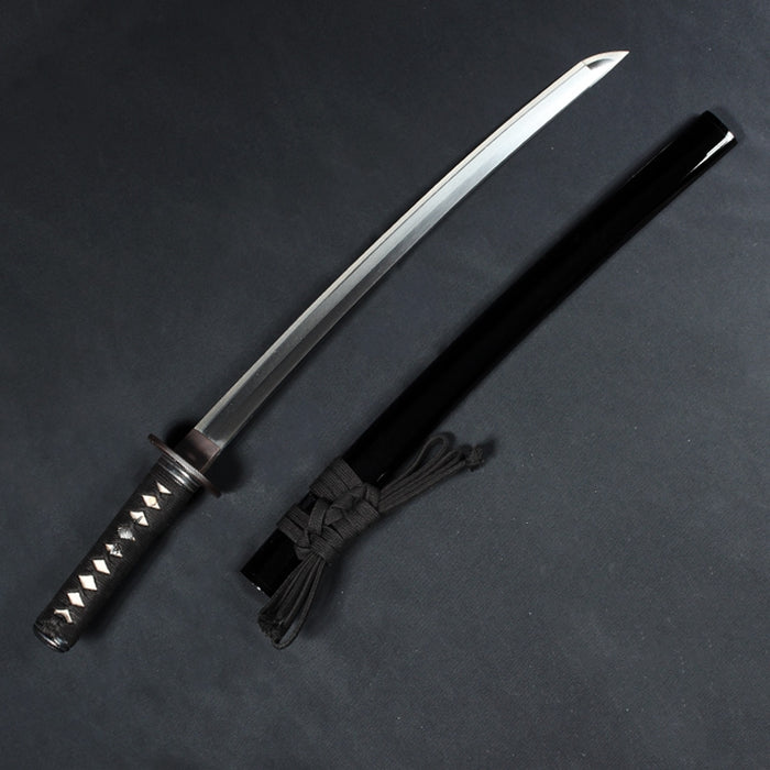 Full view of the kodachi out of its saya.